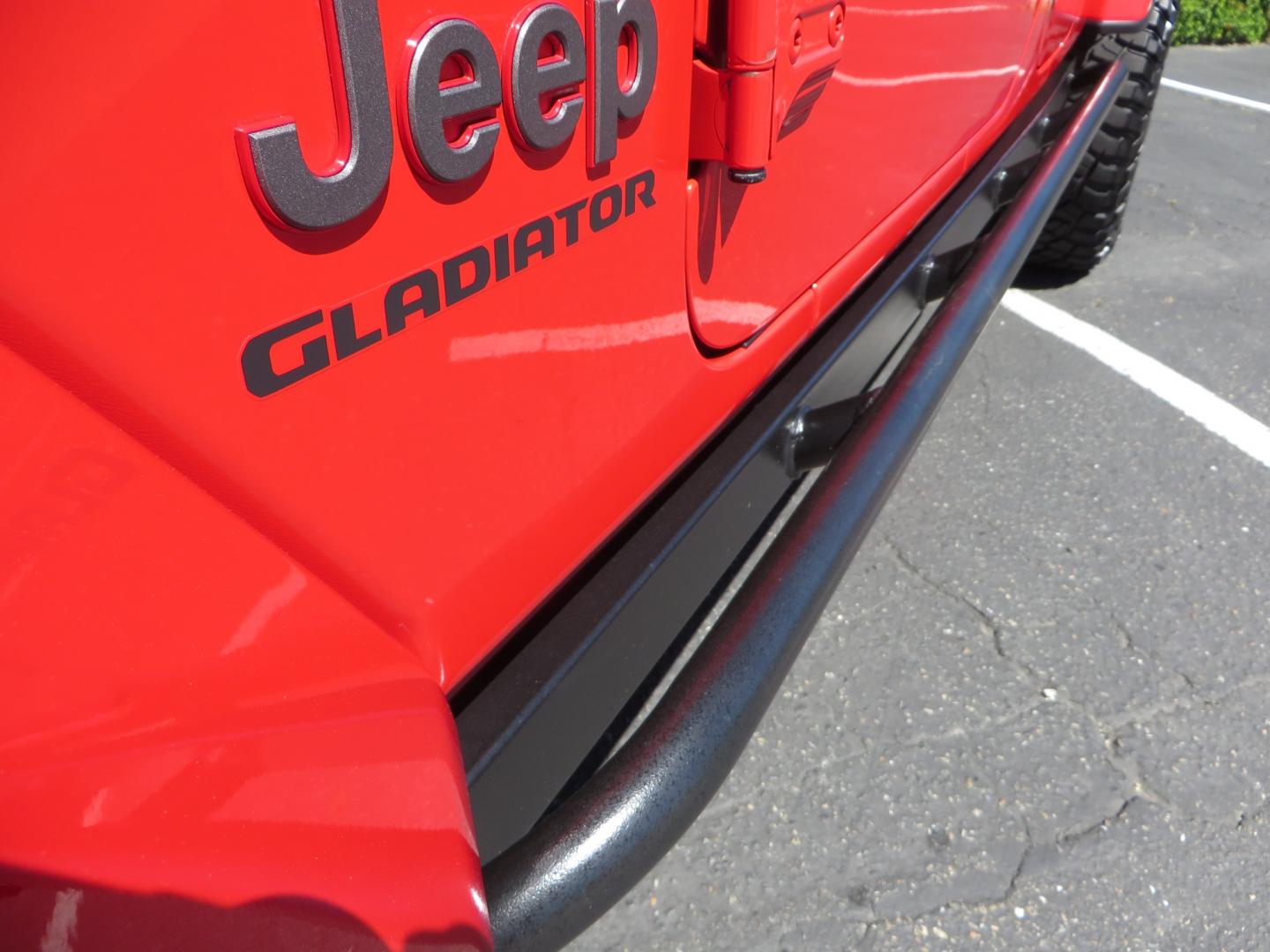 2020 Red /black Jeep Gladiator Rubicon (1C6JJTBG6LL) with an 3.6L V6 DOHC 24V engine, 6M transmission, located at 2630 Grass Valley Highway, Auburn, CA, 95603, (530) 508-5100, 38.937893, -121.095482 - Rubicon Gladiator featuring a Mopar suspension system with Fox shocks, 17" AEV wheels wrapped in 37" BFG tires, Warn Winch, Rock sliders, Cascade front license plate holder, Impact bedliner, Built Right Industries bed Molle panels, and Window tint. - Photo#11